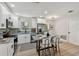 Modern kitchen with granite countertops, stainless steel appliances, and new hardwood floors at 5624 62Nd N St, St Petersburg, FL 33709