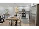 Bright kitchen featuring stainless steel appliances, hardwood floors, and a dedicated eating area at 5624 62Nd N St, St Petersburg, FL 33709