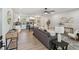 Open concept living room and kitchen area with hardwood floors and modern decor at 5624 62Nd N St, St Petersburg, FL 33709
