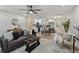 Cozy living room flowing into the kitchen area with new hardwood floors at 5624 62Nd N St, St Petersburg, FL 33709