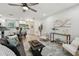 Bright living room featuring a ceiling fan, hardwood floors, and ample seating at 5624 62Nd N St, St Petersburg, FL 33709