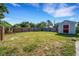Spacious backyard with a privacy fence, shed, and ample space for outdoor activities at 5711 9Th N Ave, St Petersburg, FL 33710