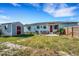 Backyard with fenced yard, shed, lawn, grill, and outdoor seating, great for outdoor gatherings at 5711 9Th N Ave, St Petersburg, FL 33710