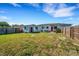 Large backyard with fence and shed, offering plenty of outdoor space with lawn at 5711 9Th N Ave, St Petersburg, FL 33710