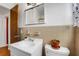 Simple bathroom featuring neutral tile, a white sink, and a pot for planting at 5711 9Th N Ave, St Petersburg, FL 33710