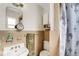 Compact bathroom featuring a sink, toilet, mirror, and a neutral color scheme at 5711 9Th N Ave, St Petersburg, FL 33710