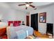 Inviting bedroom with hardwood floors, wall decor, closet access, and a comfortable bed at 5711 9Th N Ave, St Petersburg, FL 33710