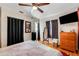 Cozy bedroom with hardwood floors, television, closet access, and a comfortable bed at 5711 9Th N Ave, St Petersburg, FL 33710