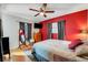 Inviting bedroom with hardwood floors, TV, natural light and a comfortable bed at 5711 9Th N Ave, St Petersburg, FL 33710