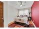 Cozy bedroom with a ceiling fan, natural light, and red accent wall at 5711 9Th N Ave, St Petersburg, FL 33710