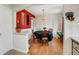 Cozy dining room featuring hardwood floors and a charming chandelier at 5711 9Th N Ave, St Petersburg, FL 33710