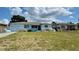 Quaint home with light blue paint and landscaping features in a residential neighborhood at 5711 9Th N Ave, St Petersburg, FL 33710