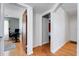 Hallway featuring wood floors with doors leading to adjacent rooms of the property at 5711 9Th N Ave, St Petersburg, FL 33710