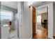 Hallway featuring wood floors with doors leading to adjacent rooms of the property at 5711 9Th N Ave, St Petersburg, FL 33710