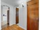 Hallway featuring wood floors and doors leading to adjacent rooms of the property at 5711 9Th N Ave, St Petersburg, FL 33710