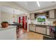 Well-lit kitchen with eat-in area, tile flooring, and ample cabinet space at 5711 9Th N Ave, St Petersburg, FL 33710