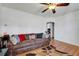 Comfortable living room featuring a fan, hardwood floors, and comfortable seating area at 5711 9Th N Ave, St Petersburg, FL 33710