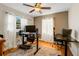 Well lit office space with hardwood floors, neutral walls, dual monitors, and two work spaces at 5711 9Th N Ave, St Petersburg, FL 33710