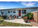 Patio area featuring outdoor grill, table with chairs, potted plants, and a fire pit at 5711 9Th N Ave, St Petersburg, FL 33710