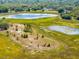 Sprawling aerial shot featuring a scenic landscape with a serene pond, underlining the property's appeal at 577 Waterfall Dr, Spring Hill, FL 34608