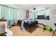 This bedroom boasts a window, a black bed frame, and carpet flooring, offering a space to personalize at 577 Waterfall Dr, Spring Hill, FL 34608