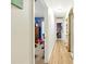Hallway with wood flooring and views into multiple rooms at 577 Waterfall Dr, Spring Hill, FL 34608