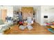 Bright living room with a stone fireplace, offering a warm and inviting space for Gathering gatherings at 577 Waterfall Dr, Spring Hill, FL 34608