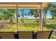 Patio with outdoor seating overlooking a lush green field at 577 Waterfall Dr, Spring Hill, FL 34608