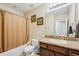 Comfortable bathroom featuring a shower and bath combination and granite vanity at 601 52Nd Ter N, St Petersburg, FL 33703