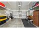 Clean, well-lit two car garage with ample storage and organized shelving space at 601 52Nd Ter N, St Petersburg, FL 33703