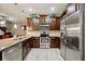 Gourmet kitchen offering granite countertops, stainless steel appliances, and ample cabinet space at 601 52Nd Ter N, St Petersburg, FL 33703