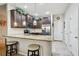 Modern kitchen boasting granite countertops, stainless appliances, and bar stool seating at 601 52Nd Ter N, St Petersburg, FL 33703