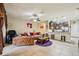 Open-concept living room featuring tile flooring and a seamless flow to the kitchen at 601 52Nd Ter N, St Petersburg, FL 33703