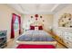 Bright main bedroom featuring a decorative bed frame, and bright natural light at 601 52Nd Ter N, St Petersburg, FL 33703
