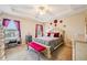Bright main bedroom featuring a decorative bed frame, and comfortable seating at 601 52Nd Ter N, St Petersburg, FL 33703