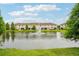 Scenic view of a serene pond, enhancing the backyard appeal of the townhome community at 601 52Nd Ter N, St Petersburg, FL 33703