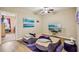 Cozy sitting area with unique bean bag chairs, modern ceiling fan and bright natural light at 601 52Nd Ter N, St Petersburg, FL 33703