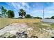 Wide backyard with a tall privacy fence, creating a private and secure outdoor space at 6403 N Lois Ave, Tampa, FL 33614