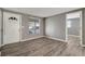 Inviting living room showcasing modern gray walls and beautiful, durable flooring throughout at 6403 N Lois Ave, Tampa, FL 33614