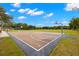 A full-sized outdoor basketball court perfect for recreation and sports, set against a backdrop of lush greenery at 6433 Reef Cir, Tampa, FL 33625