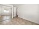 A simple bedroom with mirrored closet doors and ceramic tile flooring throughout at 6433 Reef Cir, Tampa, FL 33625