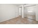 A simple bedroom with mirrored closet doors and ceramic tile flooring throughout at 6433 Reef Cir, Tampa, FL 33625