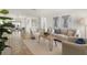 Bright living room with neutral decor, tile flooring, and natural light at 6433 Reef Cir, Tampa, FL 33625