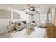 Living room featuring a ceiling fan, modern furniture, and decorative wall art at 6433 Reef Cir, Tampa, FL 33625