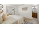 Bedroom showcasing comfortable decor, neutral walls, and mirrored closet doors at 6433 Reef Cir, Tampa, FL 33625