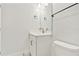 Bathroom features a white vanity with a modern faucet, toilet and stylish lighting at 7304 Donnybrook Ln, Sarasota, FL 34240