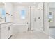 Bright bathroom features soaking tub, glass shower, neutral color palette and tile floors at 7304 Donnybrook Ln, Sarasota, FL 34240