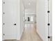 Bright entryway with light wood floors and white walls leading to the living area at 7304 Donnybrook Ln, Sarasota, FL 34240