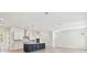 Modern kitchen with stylish lighting, stainless steel appliances, and an expansive center island at 7304 Donnybrook Ln, Sarasota, FL 34240