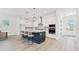 Modern kitchen features a large island with bar seating, stainless steel appliances and pendant lighting at 7304 Donnybrook Ln, Sarasota, FL 34240